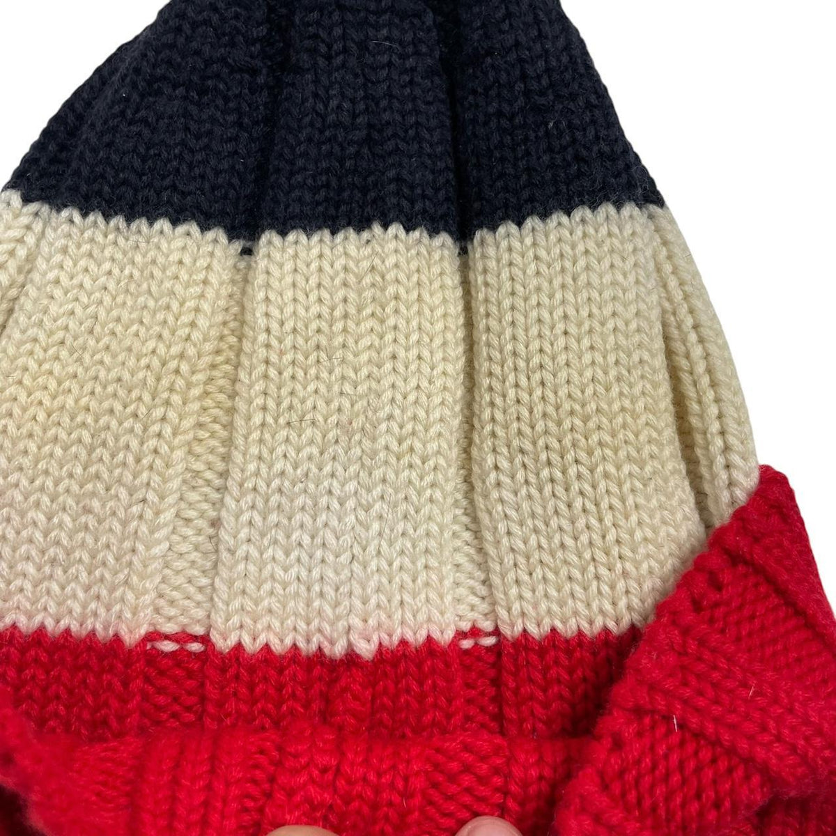Moncler cream beanie hat with colour block design and embroidered logo.