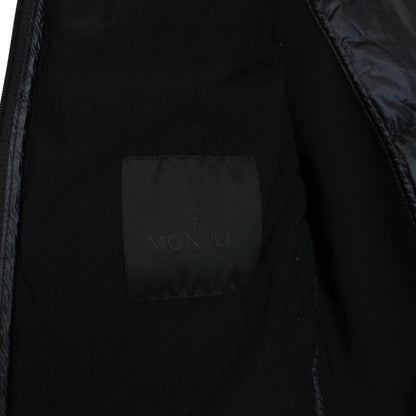 Moncler black lightweight down jacket with full zip and logo patch on sleeve.