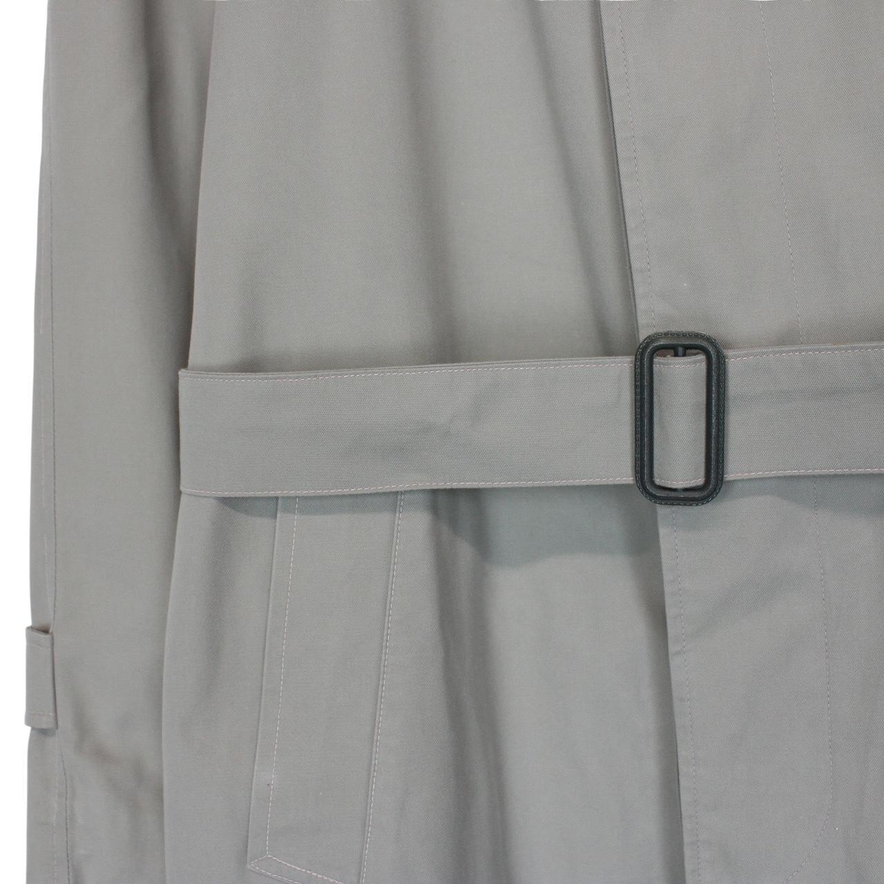 Burberry green trench coat with Nova Check pattern and single-breasted design.