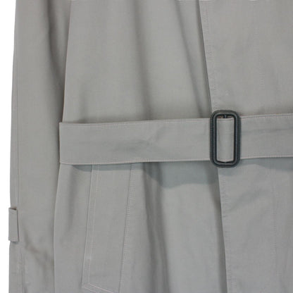 Burberry green trench coat with Nova Check pattern and single-breasted design.