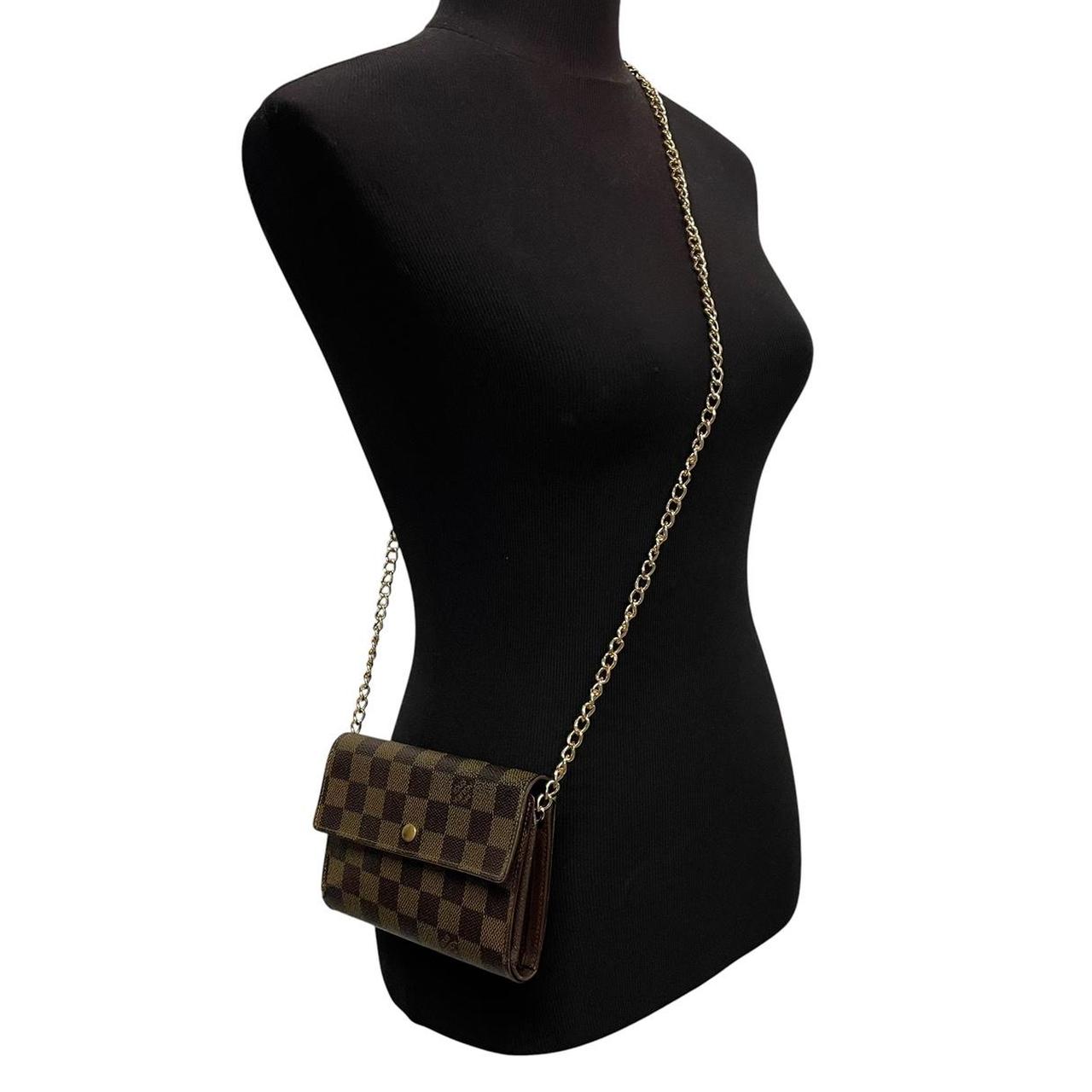 Louis Vuitton gold crossbody wallet Damier Ebene canvas with removable strap and logo.