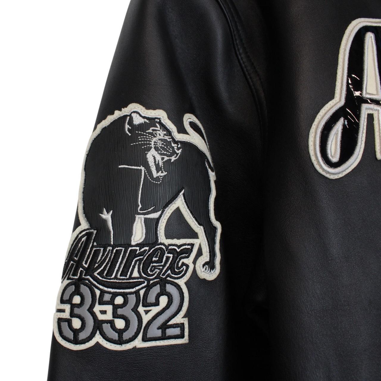 Avirex black leather jacket with Tuskegee Aces logo and full zip design.