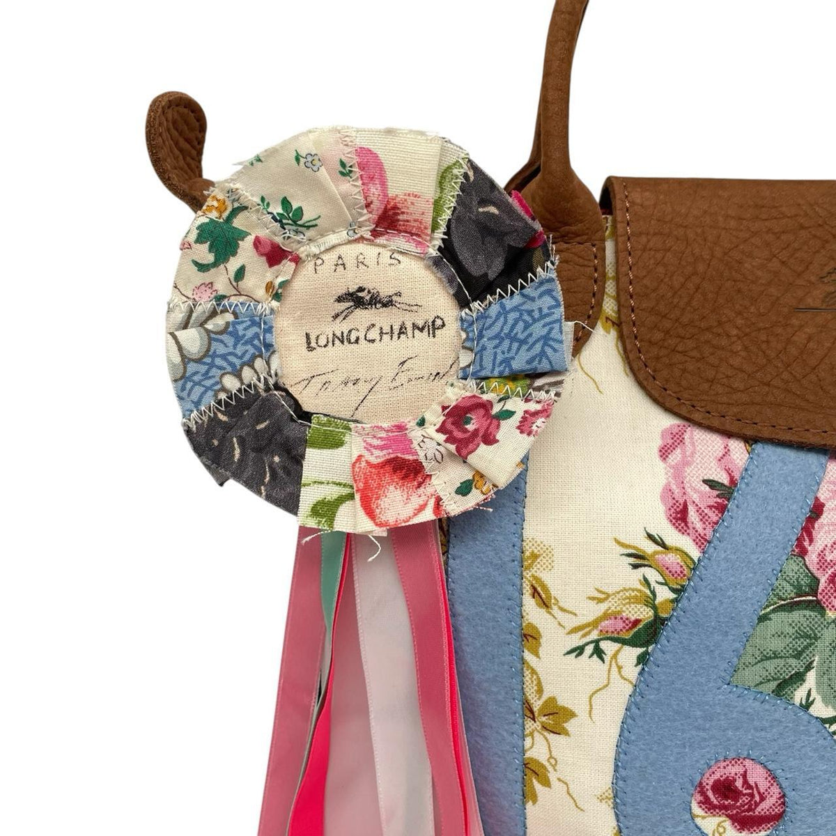 Longchamp multi tote bag featuring Tracey Emin artwork and iconic foldable design.