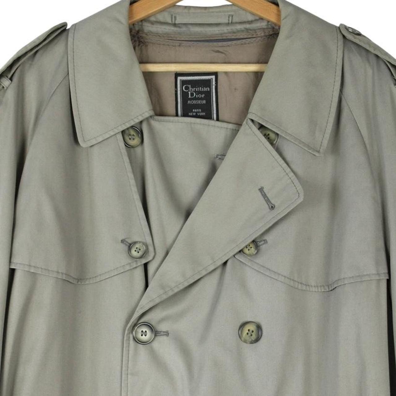 Christian Dior grey double-breasted trench coat with removable wool lining and belted waist.