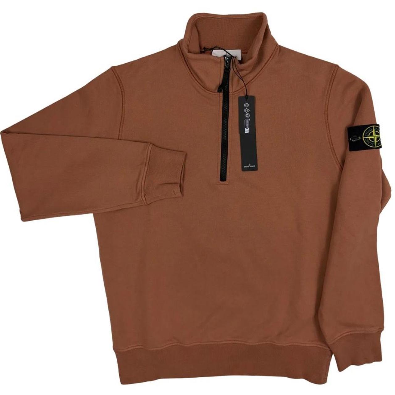 Stone Island orange jumper with 1/4 zip, logo patch on sleeve, organic cotton.