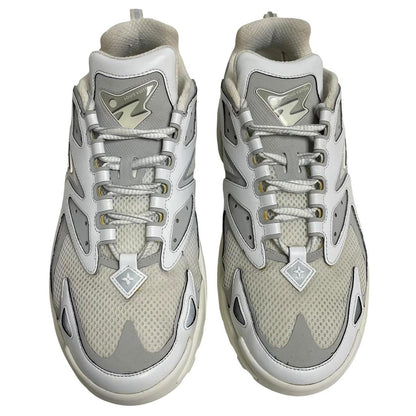 Louis Vuitton white trainers with logo detailing and sleek design, pre-owned condition.