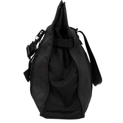 Stone Island black nylon tote bag with logo patch and crossbody strap.