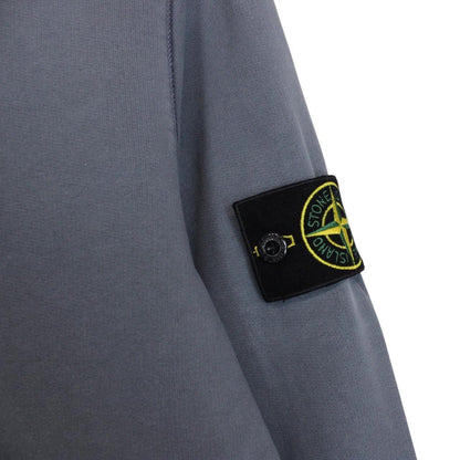 Stone Island blue cotton sweatshirt with iconic compass logo and ribbed cuffs.