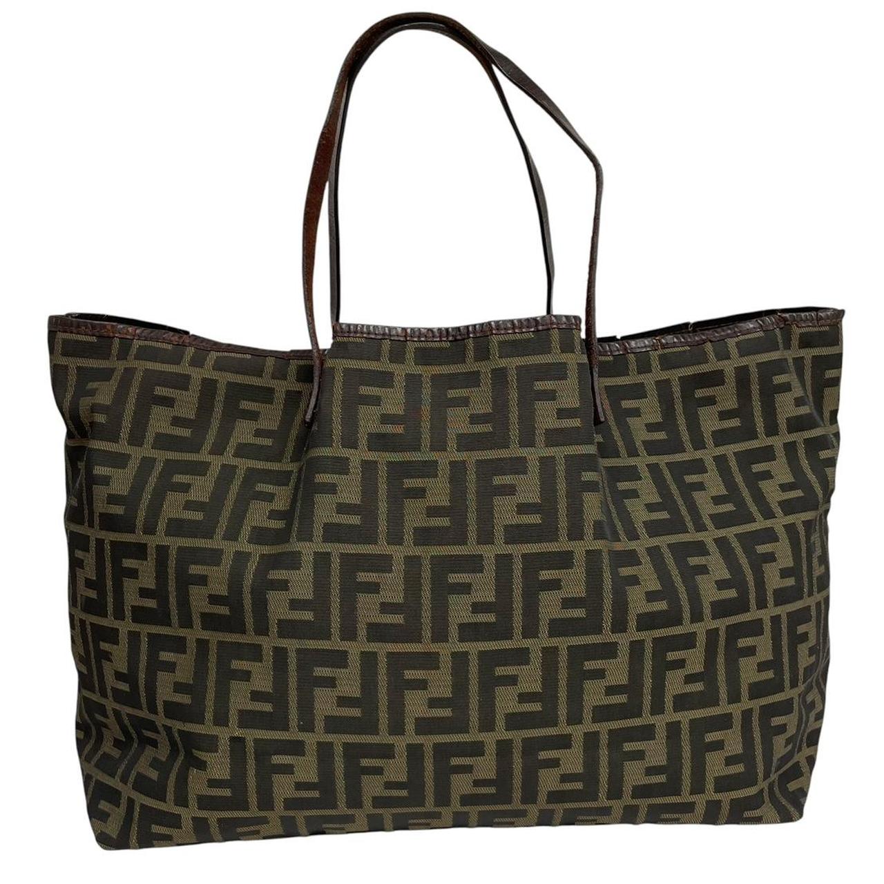 Fendi brown monogram canvas duffel bag with leather trim and logo detail.