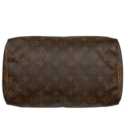 Louis Vuitton beige and brown monogram coated canvas shopping tote with padlock detail.
