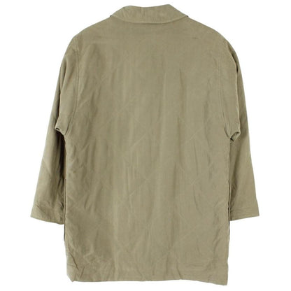Burberry khaki green quilted coat with wool lining and classic logo detail.