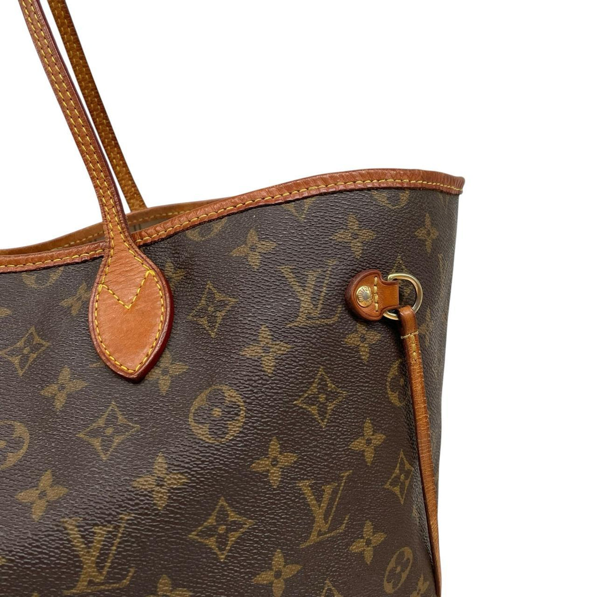 Louis Vuitton brown tote bag with monogram canvas and leather accents, pre-loved condition.