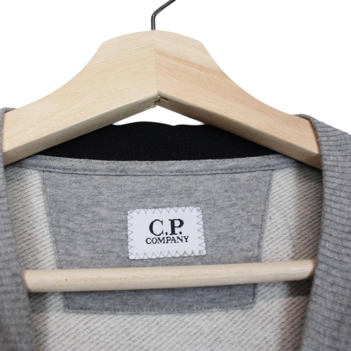 CP Company grey sweatshirt with lens detail and cotton material.