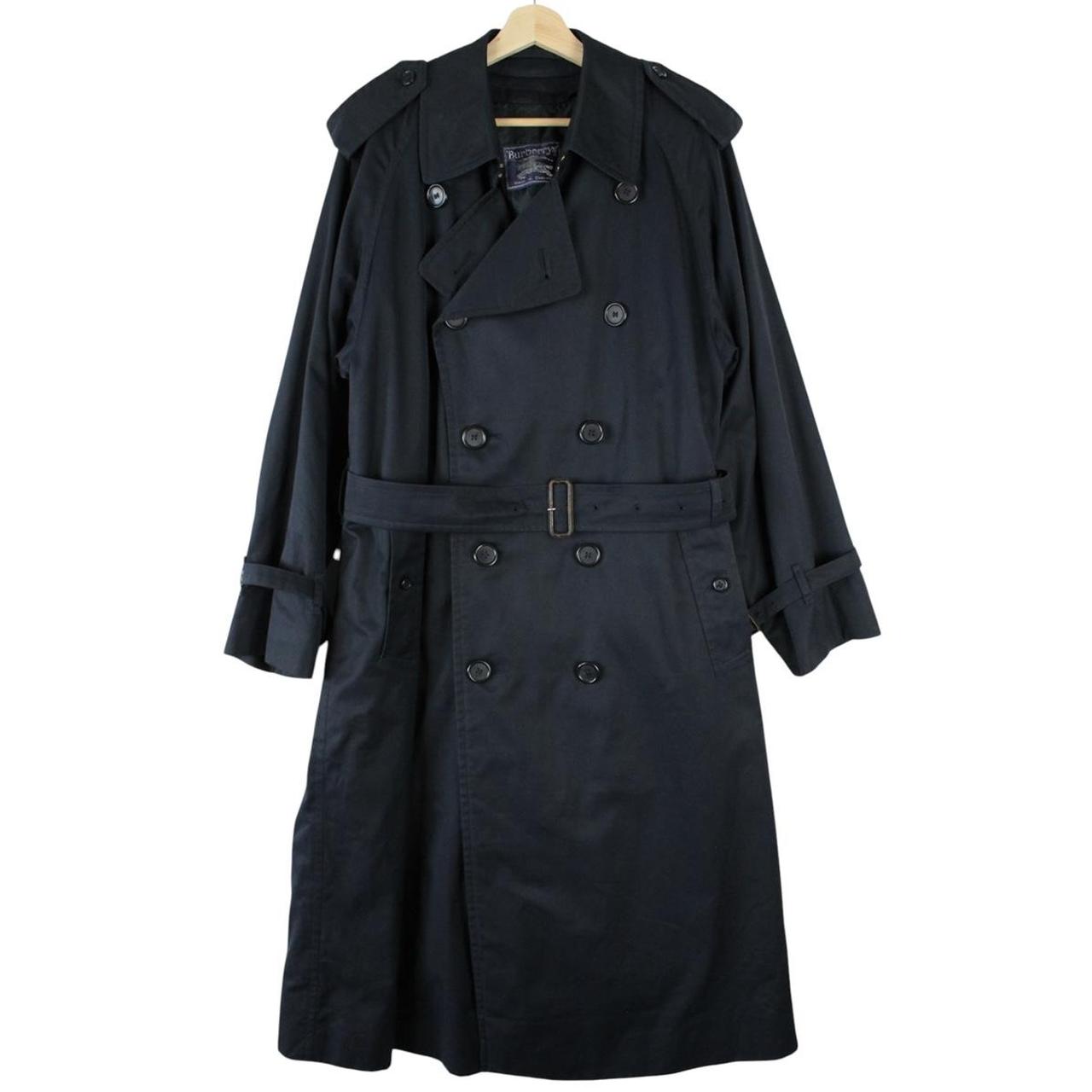 Burberry navy blue belted double breasted trench coat with iconic check lining.