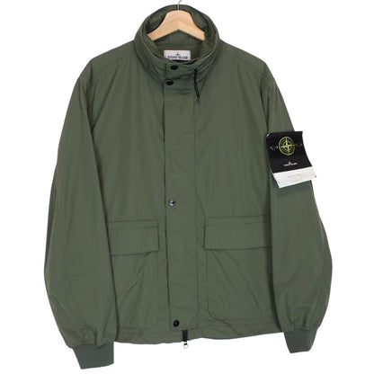 Stone Island green full zip jacket with packable hood and removable brand patch.