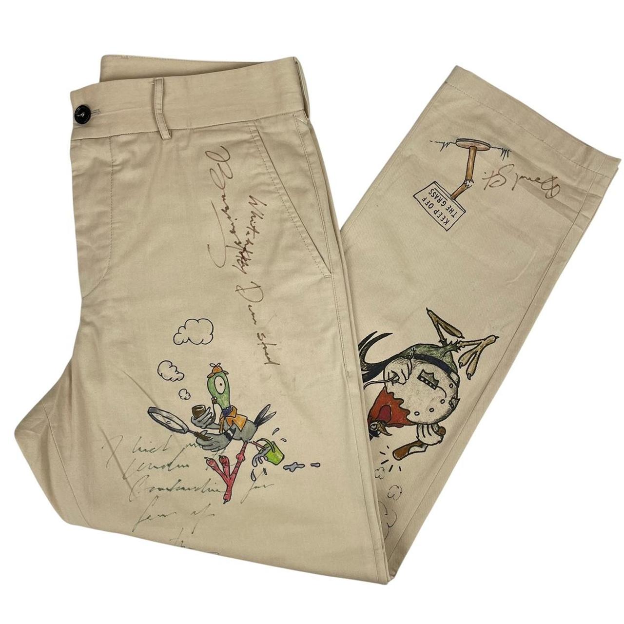 Burberry beige tapered fit trousers with sketch print design and cotton material.