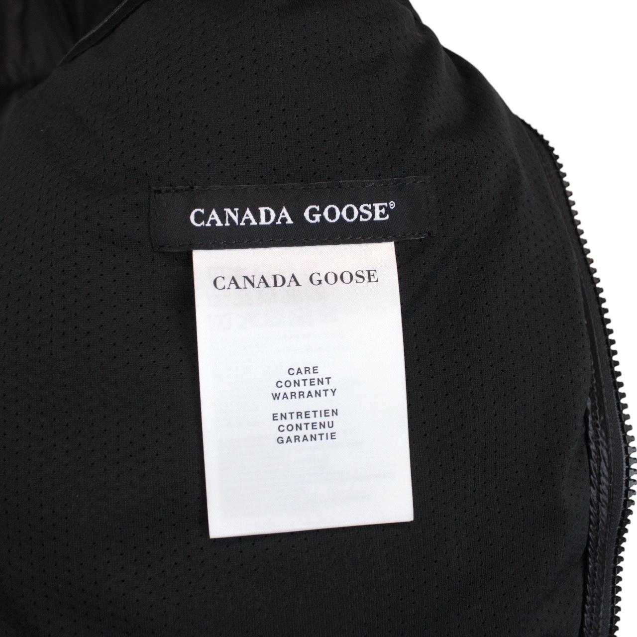 Canada Goose black down jacket with full zip and logo patch on sleeve.