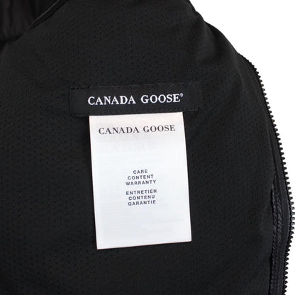 Canada Goose black down jacket with full zip and logo patch on sleeve.