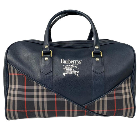 Burberry navy blue duffel bag featuring iconic Nova Check pattern and leather accents.