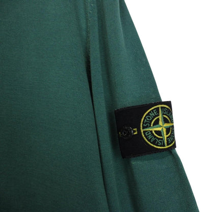 Stone Island green knit v-neck jumper with logo patch on sleeve and ribbed cuffs.