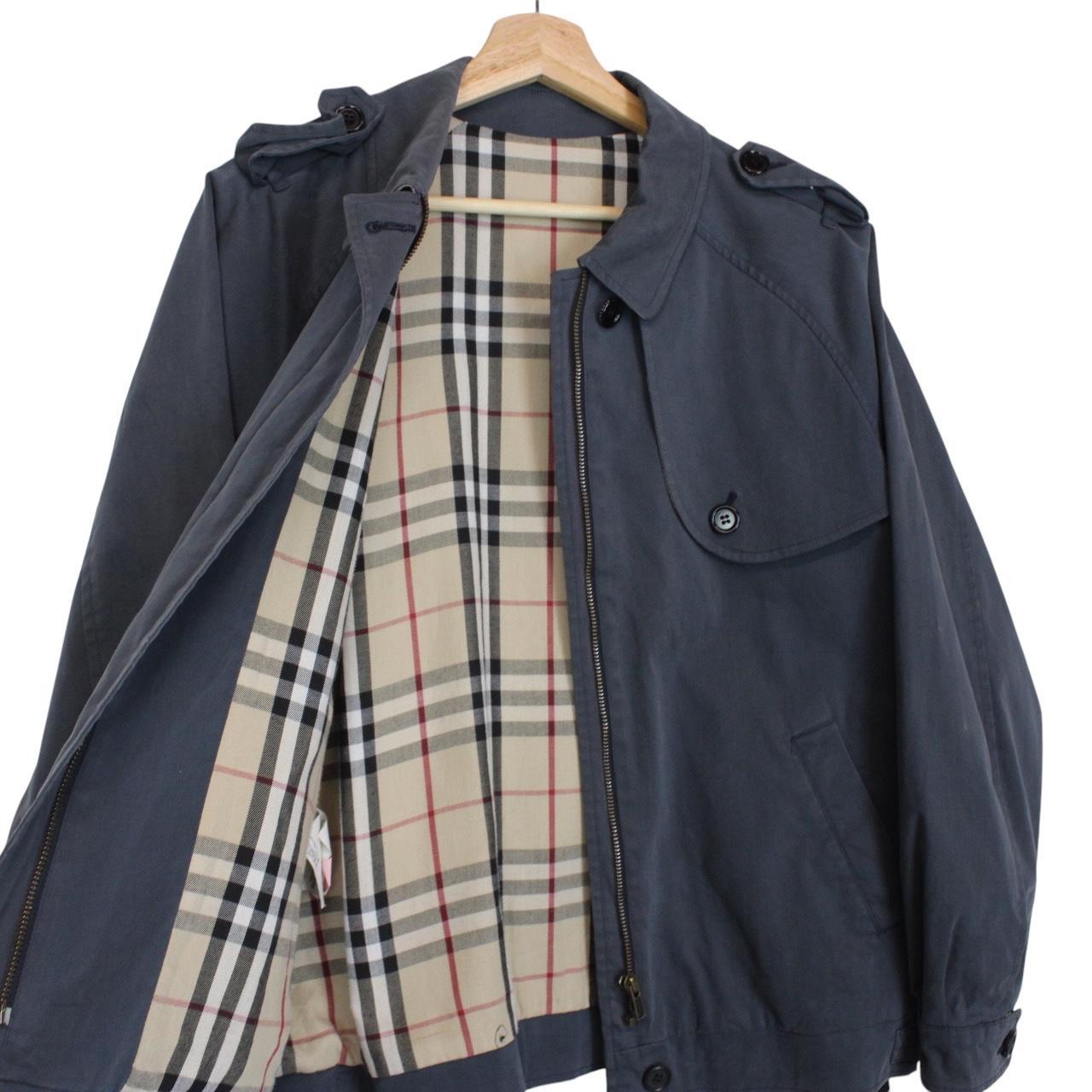 Burberry blue Harrington jacket with Nova Check lining and faint stains on sleeve.