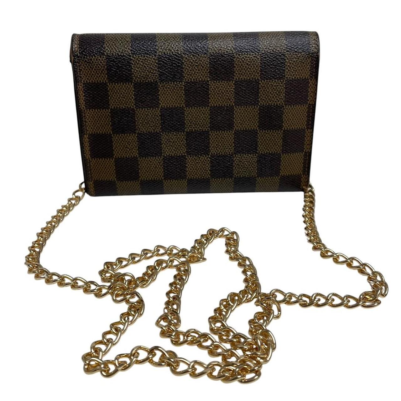 Louis Vuitton gold crossbody wallet Damier Ebene canvas with removable strap and logo.