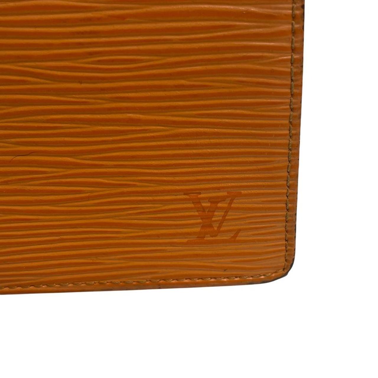 Louis Vuitton orange leather wallet with Epi texture and embossed logo detail.