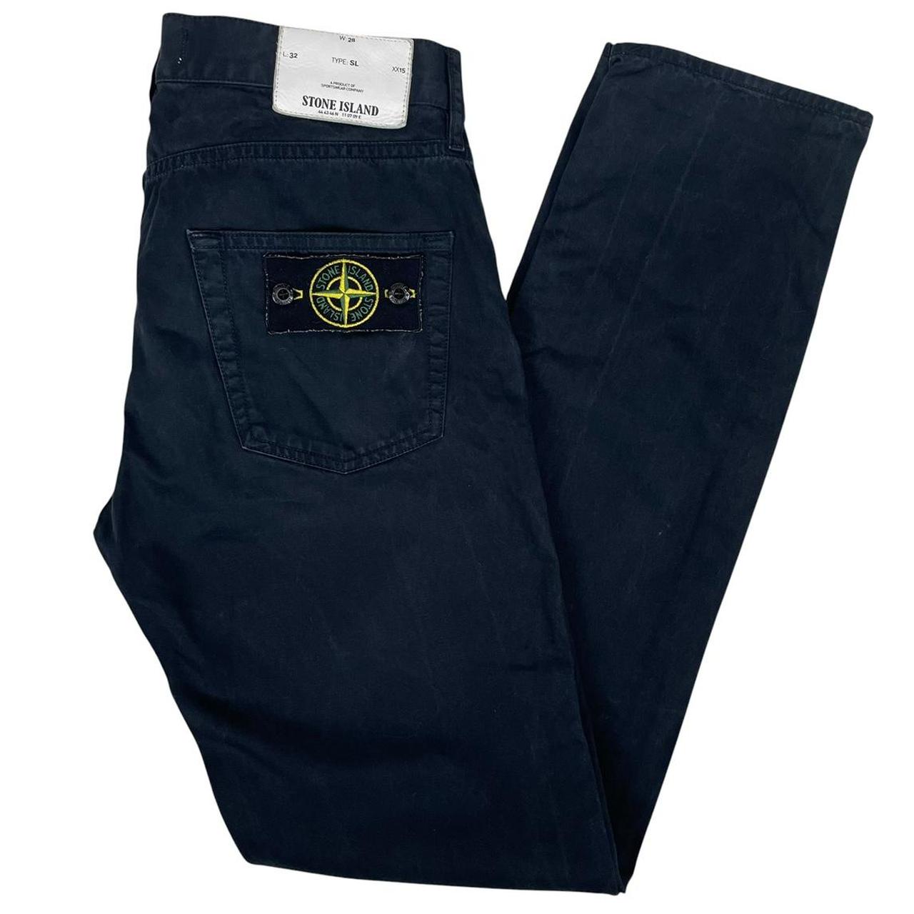 Stone Island black slim fit cotton trousers with iconic compass logo patch.
