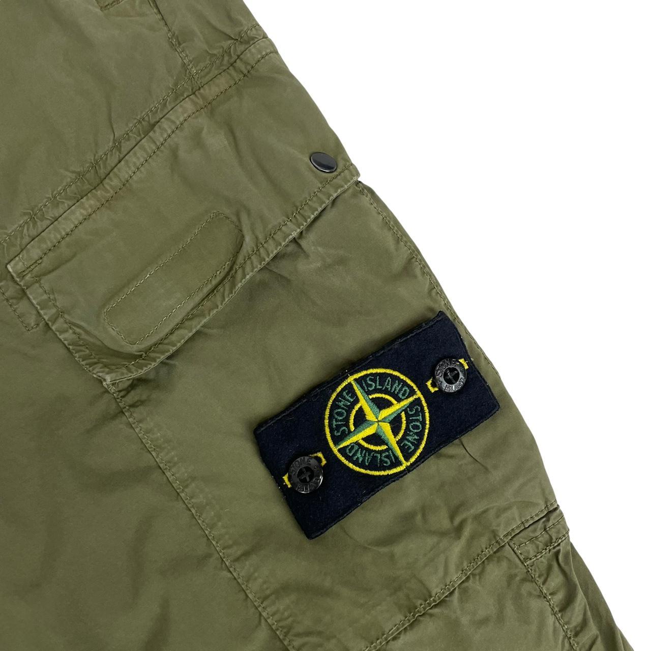 Stone Island khaki green cargo trousers with logo patch and multiple pockets.