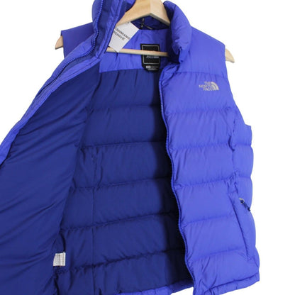 The North Face blue down gilet with logo detail and quilted pattern.