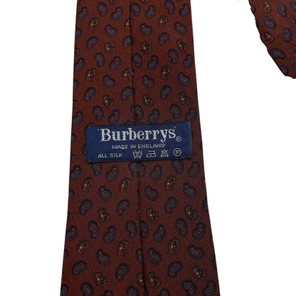 Burberry brown silk tie with vintage paisley print design and logo detail.