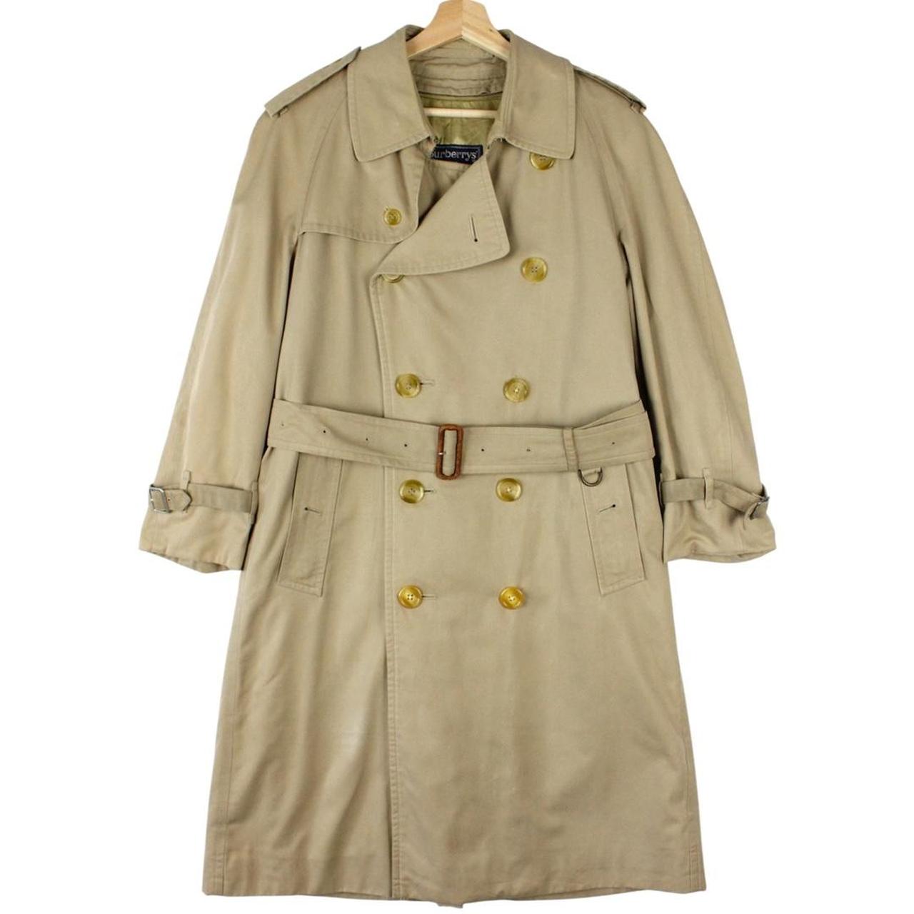 Burberry beige trench coat with Nova Check pattern, double-breasted and belted design.