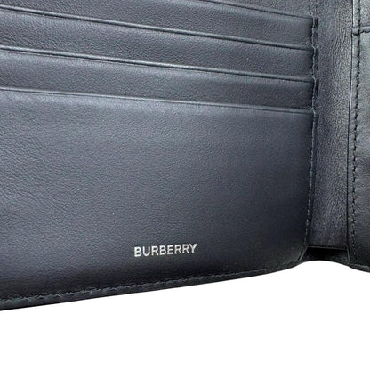 Burberry brown bifold wallet featuring iconic Nova Check pattern and coin pouch.