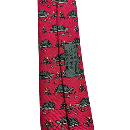 Hermes green and red silk tie featuring turtle print design and logo.