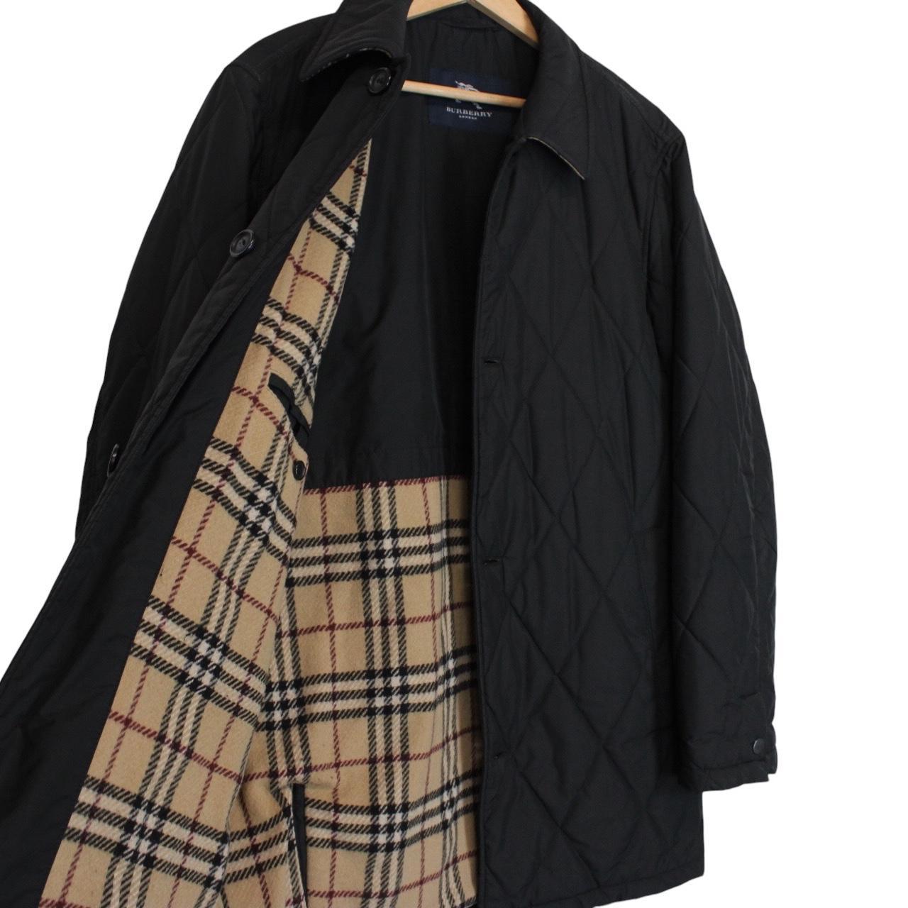 Burberry black coat with Nova Check lining and diamond quilted pattern.