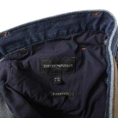 Emporio Armani navy blue slim fit denim jeans with logo patch and classic five-pocket design.