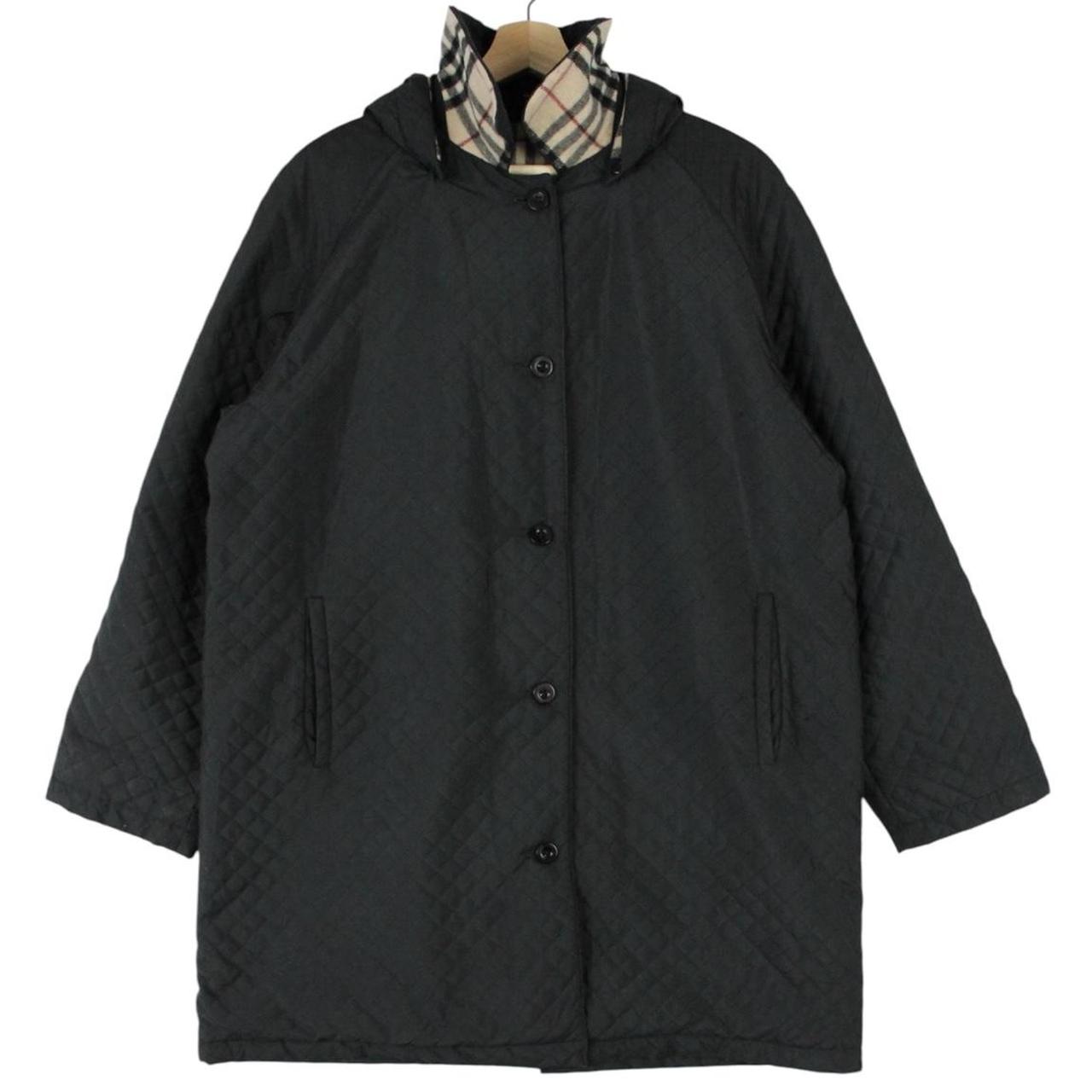 Burberry black quilted jacket with Nova Check lining and logo detail.