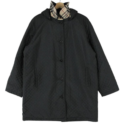 Burberry black quilted jacket with Nova Check lining and logo detail.