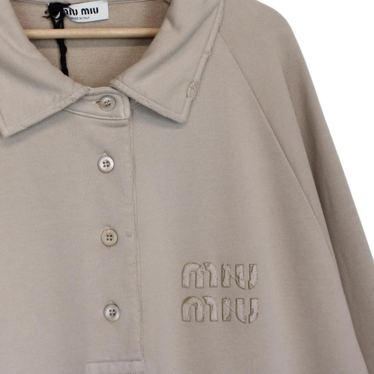 Miu Miu beige cotton polo sweatshirt with embroidered logo, oversized fit, brand new with tags.
