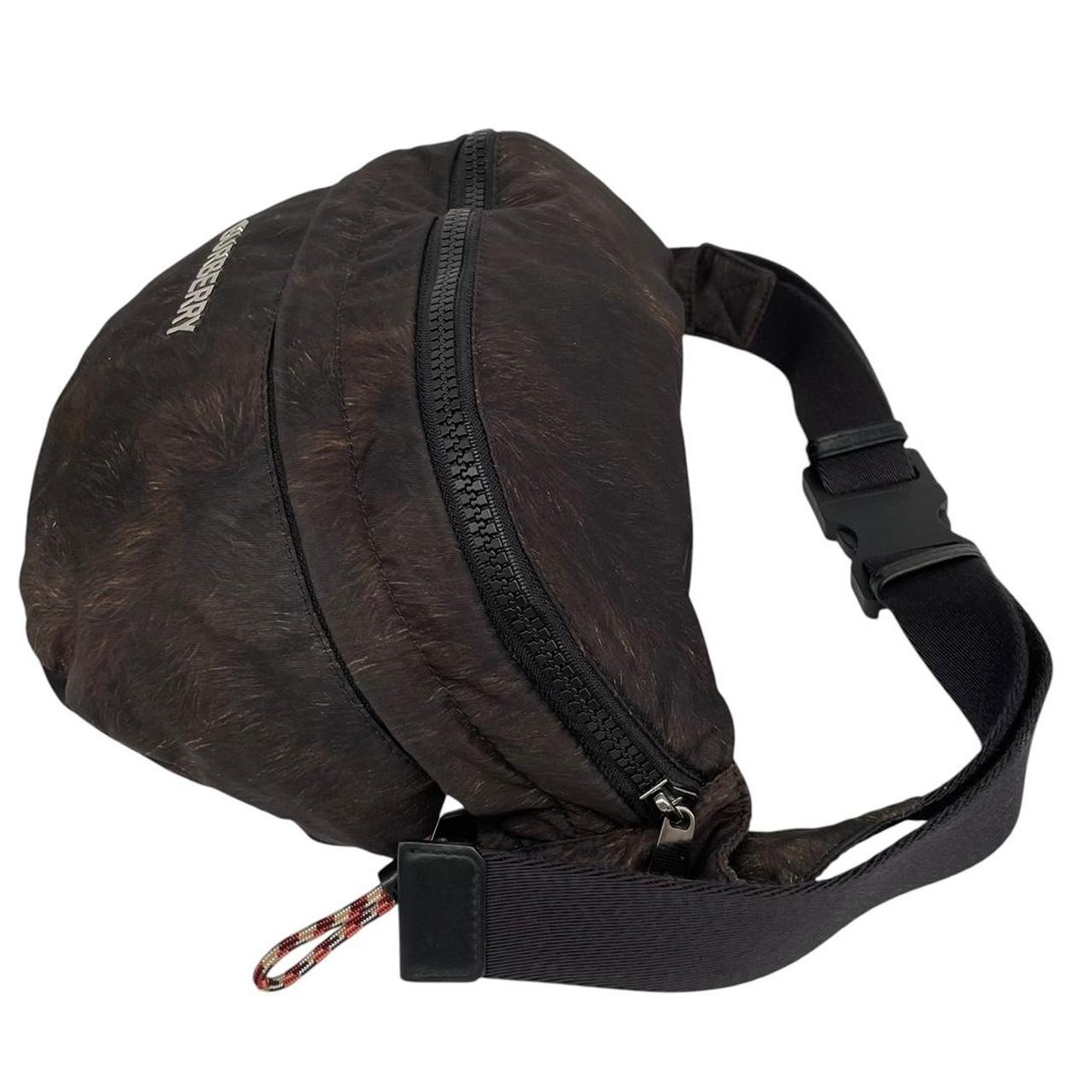 Burberry brown and black convertible bum bag with ape logo and durable material.