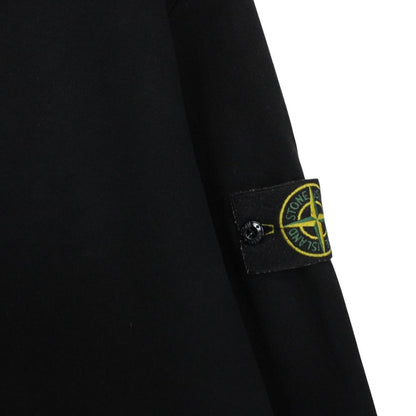 Stone Island black full zip hoodie with logo patch and cotton material.