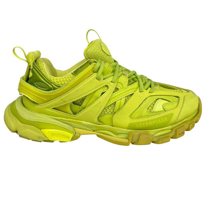 Balenciaga green low top trainers with logo detailing and textured mesh upper.