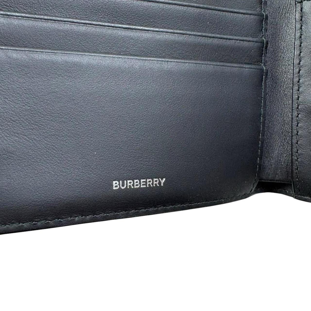 Burberry bifold wallet tan brown Nova Check pattern with logo detail.