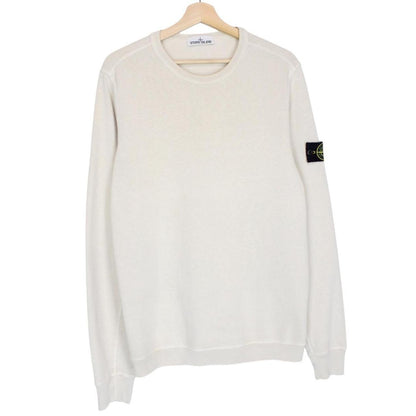 Stone Island beige cotton sweatshirt with logo patch and ribbed cuffs.