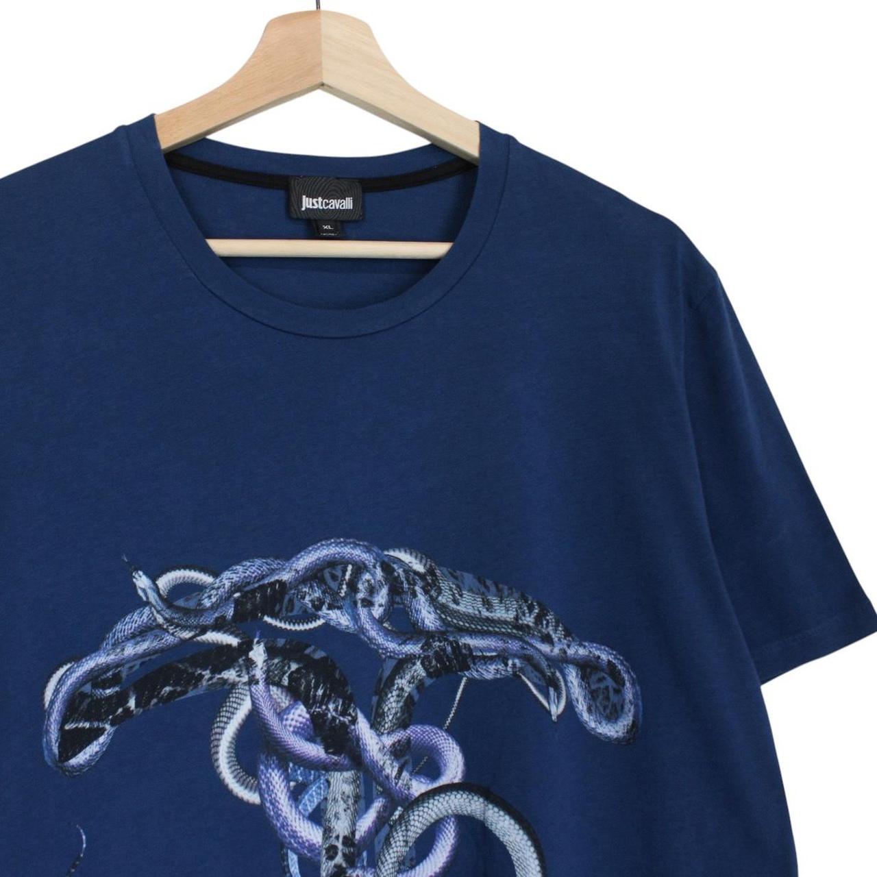 Just Cavalli blue pocket t-shirt with snake print design and cotton material.