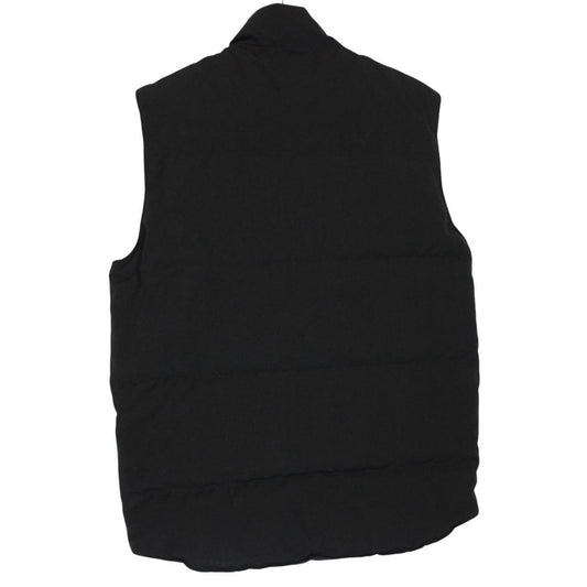 Canada Goose black down gilet with logo patch and zippered pockets.