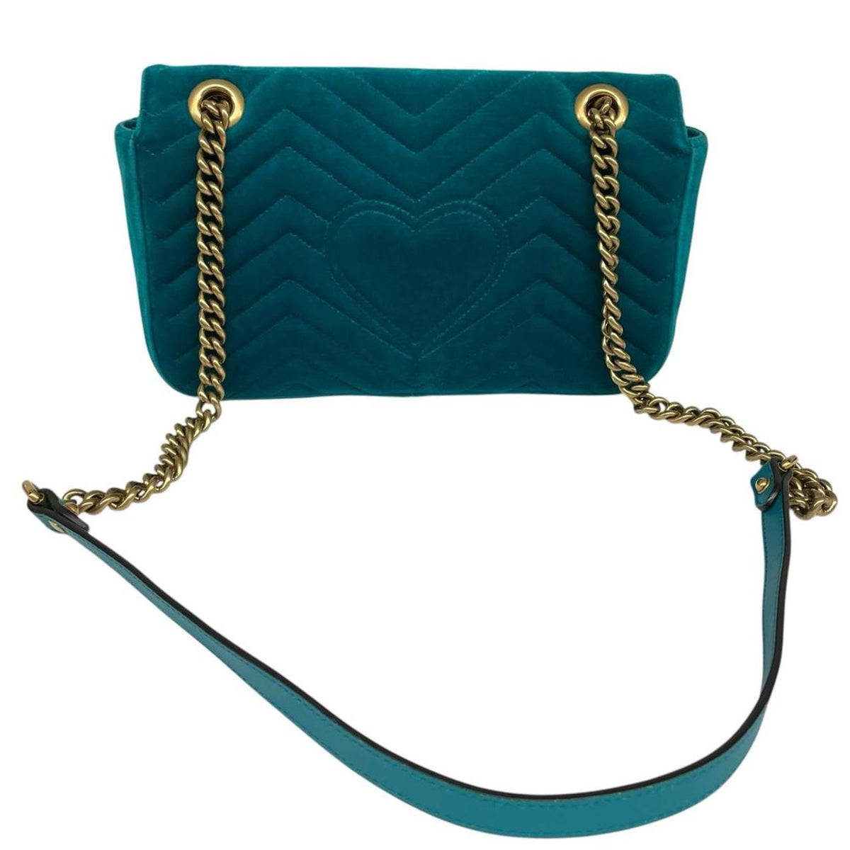Gucci turquoise velvet shoulder bag with gold GG logo and green accents.