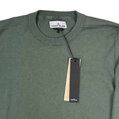 Stone Island green knit jumper made from organic cotton with logo patch detail.
