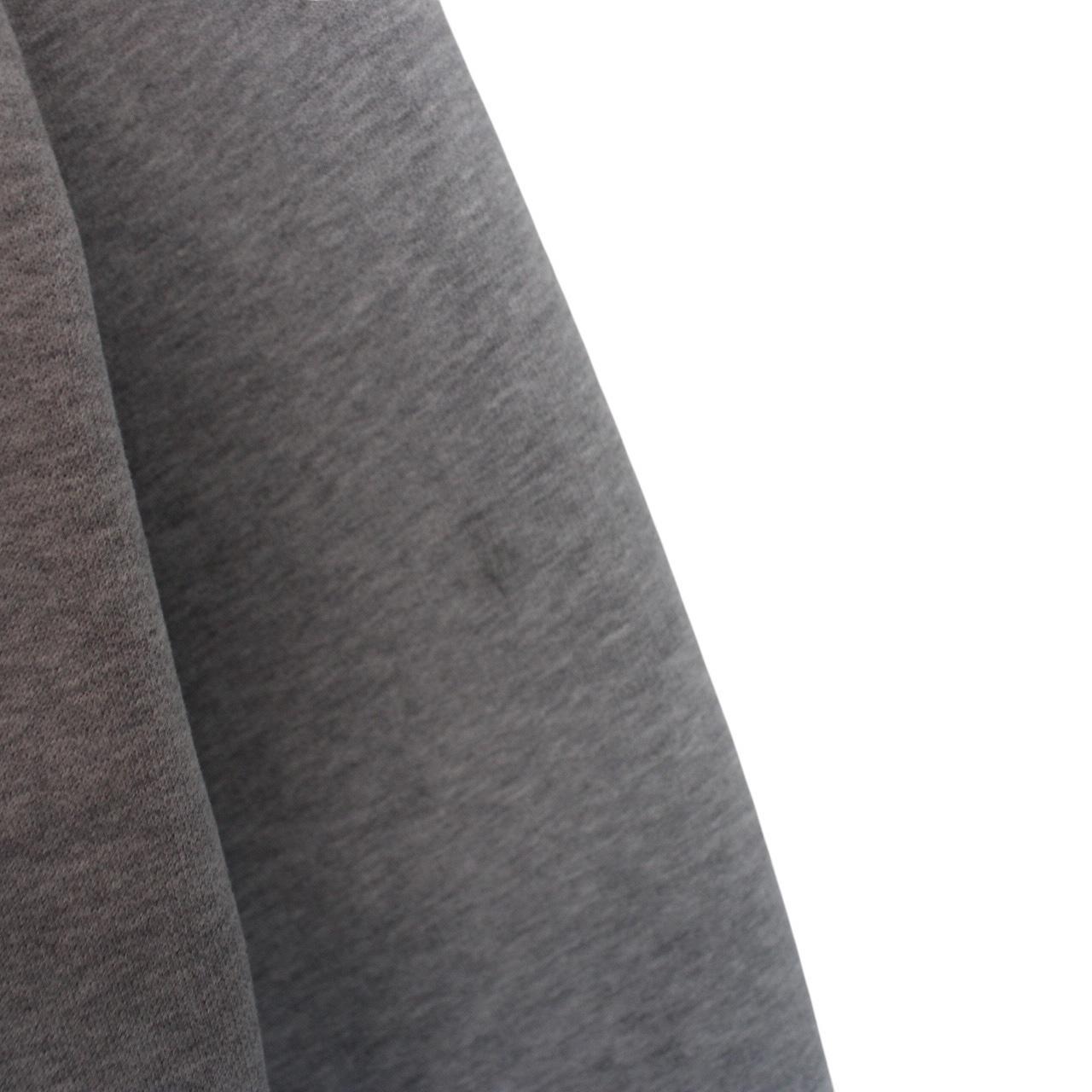 Stone Island grey cotton sweatshirt with logo patch and faint mark on sleeve.