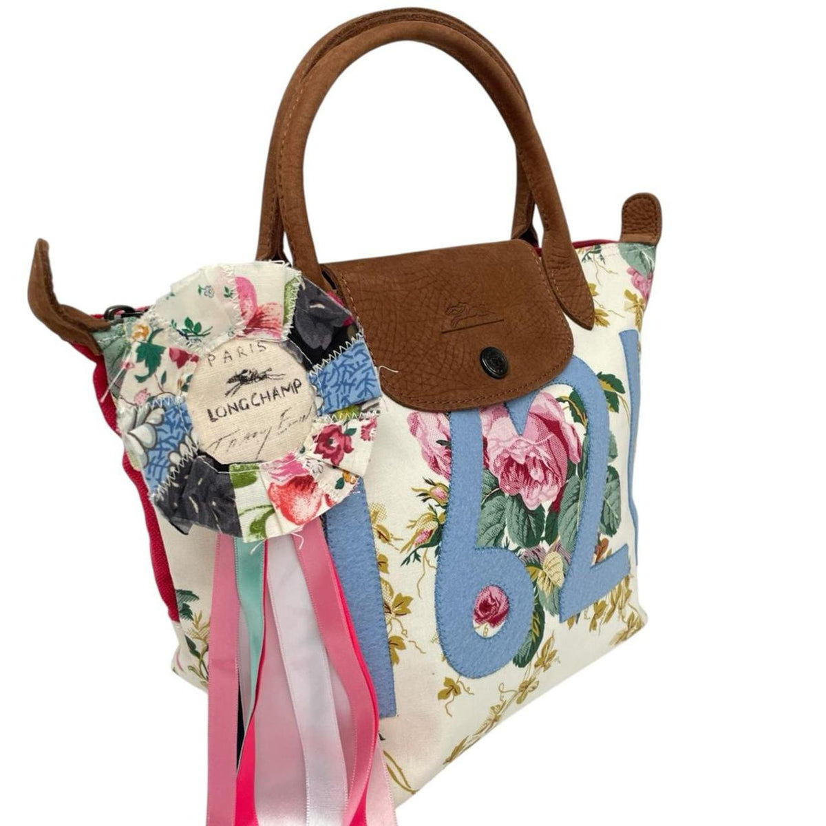 Longchamp multi tote bag featuring Tracey Emin artwork and iconic foldable design.